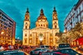 BUDAPEST, HUNGARY-MAY 05,2016: St. Stephen Basilica in Budapest at nightime and sport car show with peoples Royalty Free Stock Photo