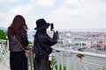 Two young asian women taking pictures of the scenic views of Budapest Royalty Free Stock Photo
