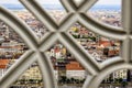 View of the old houses of the capital from the observation deck of Gellert hill through a metal decorative lattice, Hungary