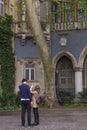 A young tourist couple at the Vajdahunyad Castle yard, also known as the Dracula castle.