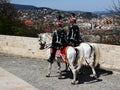 Old style mounted Hungarian soldiers called huszars on white horse in Budapest