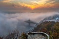 Budapest, Hungary - Mysterious foggy sunrise with Liberty Bridge Szabadsag hid and lookout on Gellert Hill Royalty Free Stock Photo