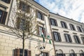 Budapest, Hungary - Nov 6, 2019: Detail of the building facade of the Court Theatre of Buda. Waving Hungarian flags. Budapest