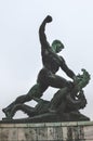 Budapest, Hungary - Nov 6, 2019: Side statue of the Liberty Statue on Gellert hill in Budapest in Hungary. Man slaying and Royalty Free Stock Photo