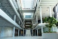 the interior atrium and lobby space of the MOL headquarter tower and campus in Budapest, Hungary