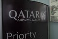 Budapest, Hungary - 1 November 2021: Qatar Airways company logo close-up in airport, priority line, Illustrative Editorial