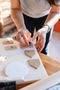 Budapest, Hungary - October 19, 2109: Tradittional home-made gingerbread baking. Cuting the dough with shapes for gingerbread