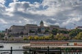 View of the Danube River and the Hungarian Parliament Building with a restaurant ship in the foreground Royalty Free Stock Photo