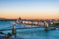 View of the Szechenyi Chain Bridge over Danube and the Hungarian Parliament Building in Budapest, Hungary Royalty Free Stock Photo