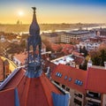 Budapest, Hungary - Old traditional metal tower and red rooftops of Castle District with rising sun, St. Stephens Basilica Royalty Free Stock Photo