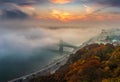 Budapest, Hungary - Panoramic view of mysterious foggy sunrise with Liberty Bridge Szabadsag hid Royalty Free Stock Photo