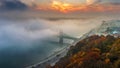Budapest, Hungary - Panoramic view of mysterious foggy sunrise with Liberty Bridge Szabadsag hid Royalty Free Stock Photo