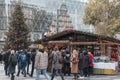 19-11-2022 BUDAPEST, HUNGARY: People visiting Christmas market or fair in the city center, huge christmas tree with red Royalty Free Stock Photo