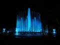 Blue color musical fountain. Magnificent night show of colorful lights, laser beams,