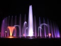 Colorful musical fountain. Magnificent night show of colorful lights, laser beams, music Royalty Free Stock Photo