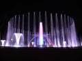 Colorful musical fountain. Magnificent night show of colorful lights, laser beams, music Royalty Free Stock Photo