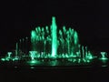 Green color musical fountain. Magnificent night show of colorful lights, laser beams, Royalty Free Stock Photo