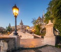 Budapest, Hungary - Sunrise at the entrance of Fisherman`s Bastion halaszbastya with street-lamp Royalty Free Stock Photo