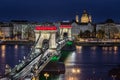 Budapest, Hungary - The world famous illuminated Szechenyi Chain Bridge Lanchid by night, lit up with national colours Royalty Free Stock Photo