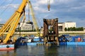 yellow steel floating crane on the river. the largest bridge building crane on the Danube river