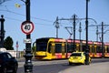 Yellow tram and taxi cab on busy street in Budapest. summer day. Royalty Free Stock Photo