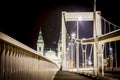 Budapest modern white bridge with baroque church in background. Royalty Free Stock Photo