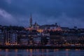 Budapest night cityscape over Danube river and the castle in the background.