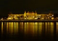 Budapest night view along the Danube with attractively lit institutional building