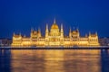 Budapest parliament illuminated at night and Danube river Hungary Royalty Free Stock Photo