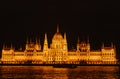Budapest parliament night yellow illumination river bank