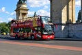 Budapest. red double decker tourist and sightseeing bus at the Heros&# Square with tourists