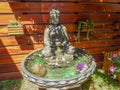 Buddah fountain in a beautiful garden