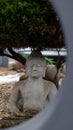 A buddah statue behind a circle