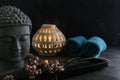 Buddah witn candle and towel spa concept Royalty Free Stock Photo