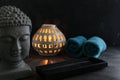 Buddah witn candle and towel spa concept Royalty Free Stock Photo