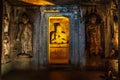 Buddha in beams of artificial lighting. Royalty Free Stock Photo