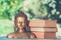 Buddha and books. Buddhism and meditation. Buddha sculpture