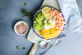 Buddha bowl with avocado, prawns, rice, on light background. Healthy food, clean eating, Buddha bowl, top view Royalty Free Stock Photo