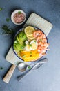 Buddha bowl with avocado, prawns, rice, on light background. Healthy food, clean eating, Buddha bowl, top view