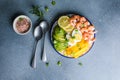 Buddha bowl with avocado, prawns, rice, on light background. Healthy food, clean eating, Buddha bowl, top view