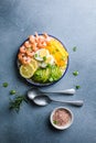 Buddha bowl with avocado, prawns, rice, on light background. Healthy food, clean eating, Buddha bowl, top view