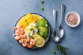 Buddha bowl with avocado, prawns, rice, on light background. Healthy food, clean eating, Buddha bowl, top view