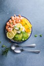 Buddha bowl with avocado, prawns, rice, on light background. Healthy food, clean eating, Buddha bowl, top view Royalty Free Stock Photo