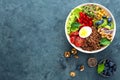 Buddha bowl dinner with boiled egg, chickpea, fresh tomato, sweet pepper, cucumber, savoy cabbage, red onion, green sprouts Royalty Free Stock Photo