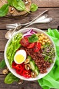 Buddha bowl dish with boiled egg, chickpea, fresh tomato, sweet pepper, cucumber, savoy cabbage, red onion, green sprouts, spinach Royalty Free Stock Photo