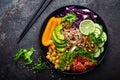 Buddha bowl dish with brown rice, avocado, pepper, tomato, cucumber, red cabbage, chickpea, fresh lettuce salad and walnuts. Healt Royalty Free Stock Photo