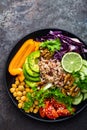 Buddha bowl dish with brown rice, avocado, pepper, tomato, cucumber, red cabbage, chickpea, fresh lettuce salad and walnuts. Healt Royalty Free Stock Photo