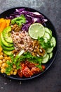 Buddha bowl dish with brown rice, avocado, pepper, tomato, cucumber, red cabbage, chickpea, fresh lettuce salad and walnuts. Healt Royalty Free Stock Photo