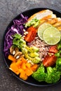 Buddha bowl dish with chicken fillet, brown rice, avocado, pepper, tomato, broccoli, red cabbage, chickpea, fresh lettuce salad, p Royalty Free Stock Photo