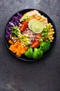 Buddha bowl dish with chicken fillet, brown rice, avocado, pepper, tomato, broccoli, red cabbage, chickpea, fresh lettuce salad, p Royalty Free Stock Photo